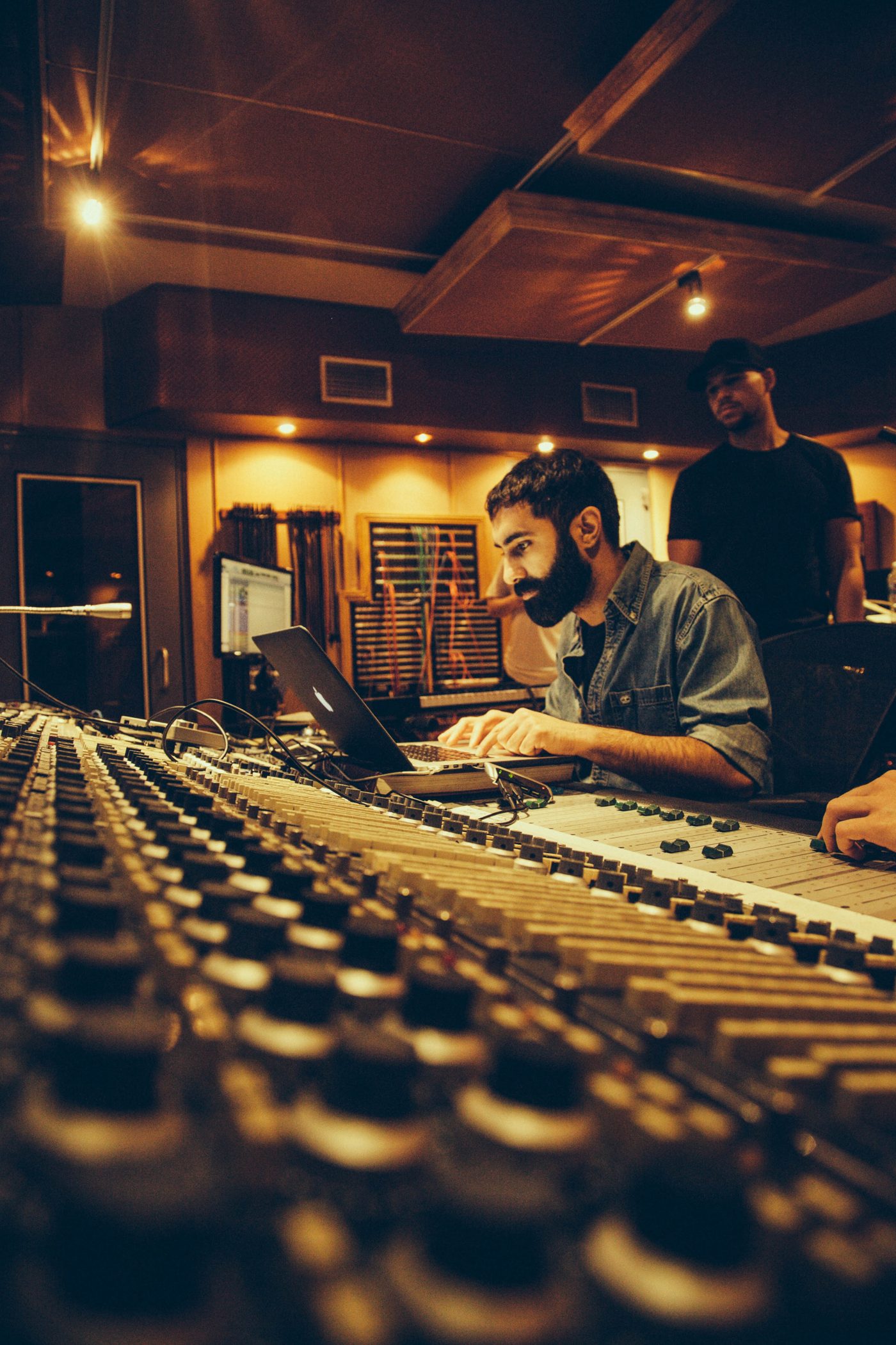 Amir Amor, record producer, at the mixing console in the studio